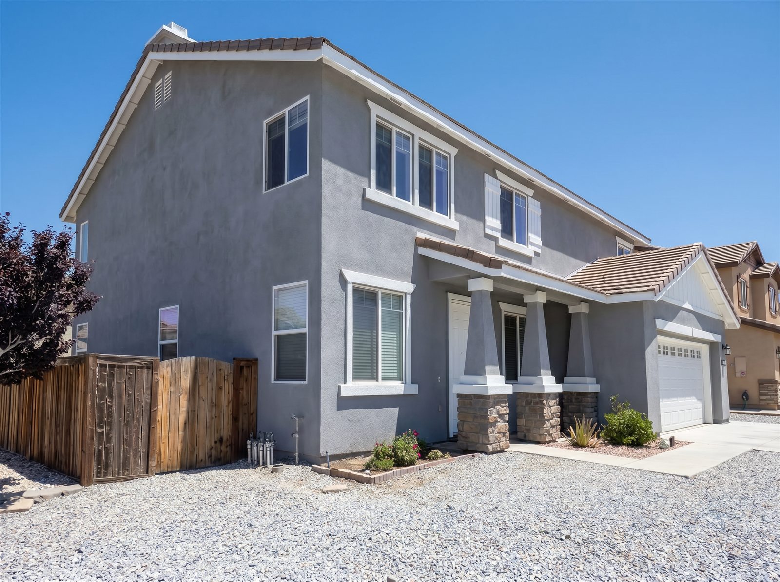 Completed gray smooth-coat stucco home by A1 Smooth and Stucco